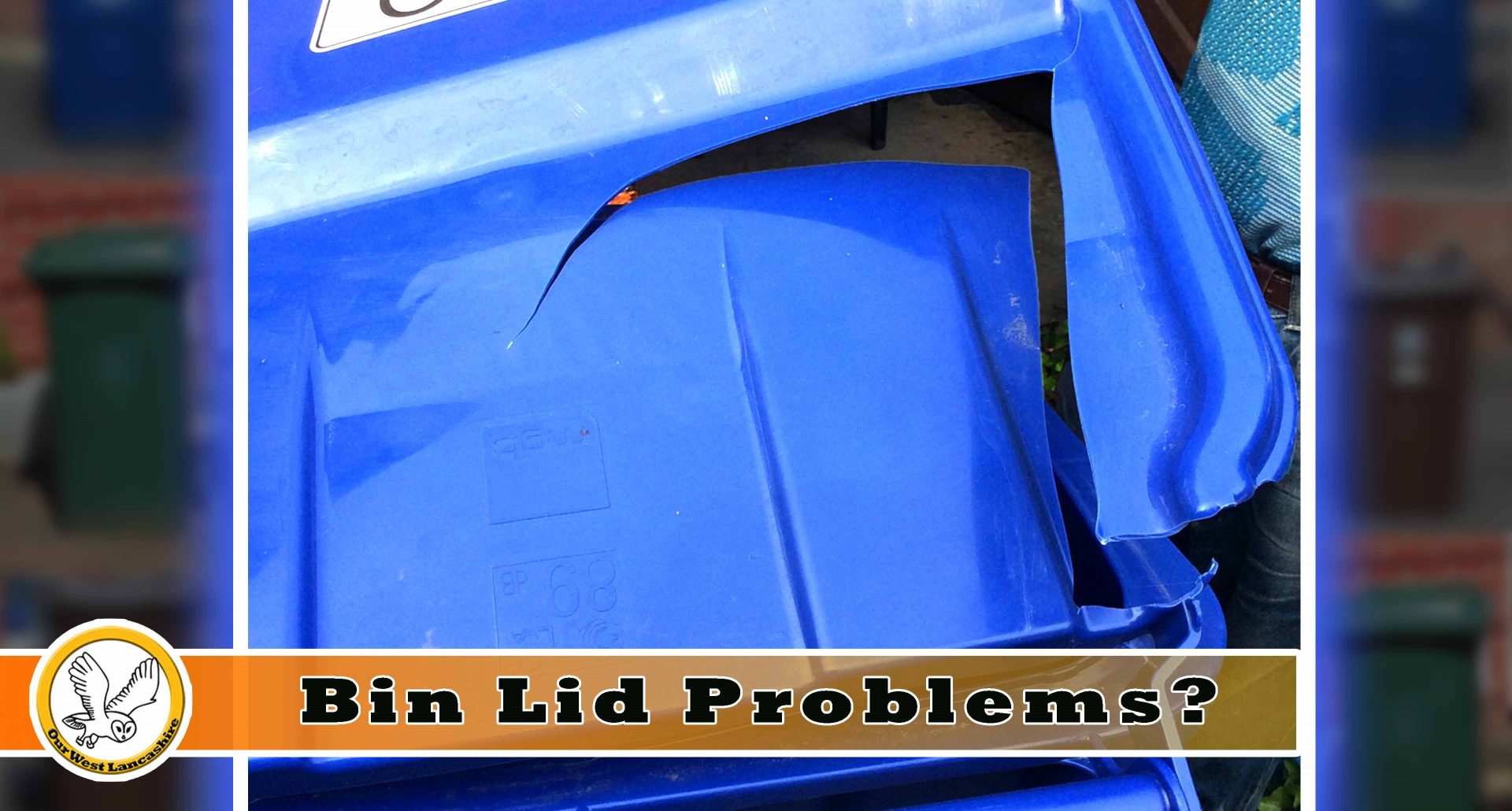 Picture of a blue recycling bin with a broken lid